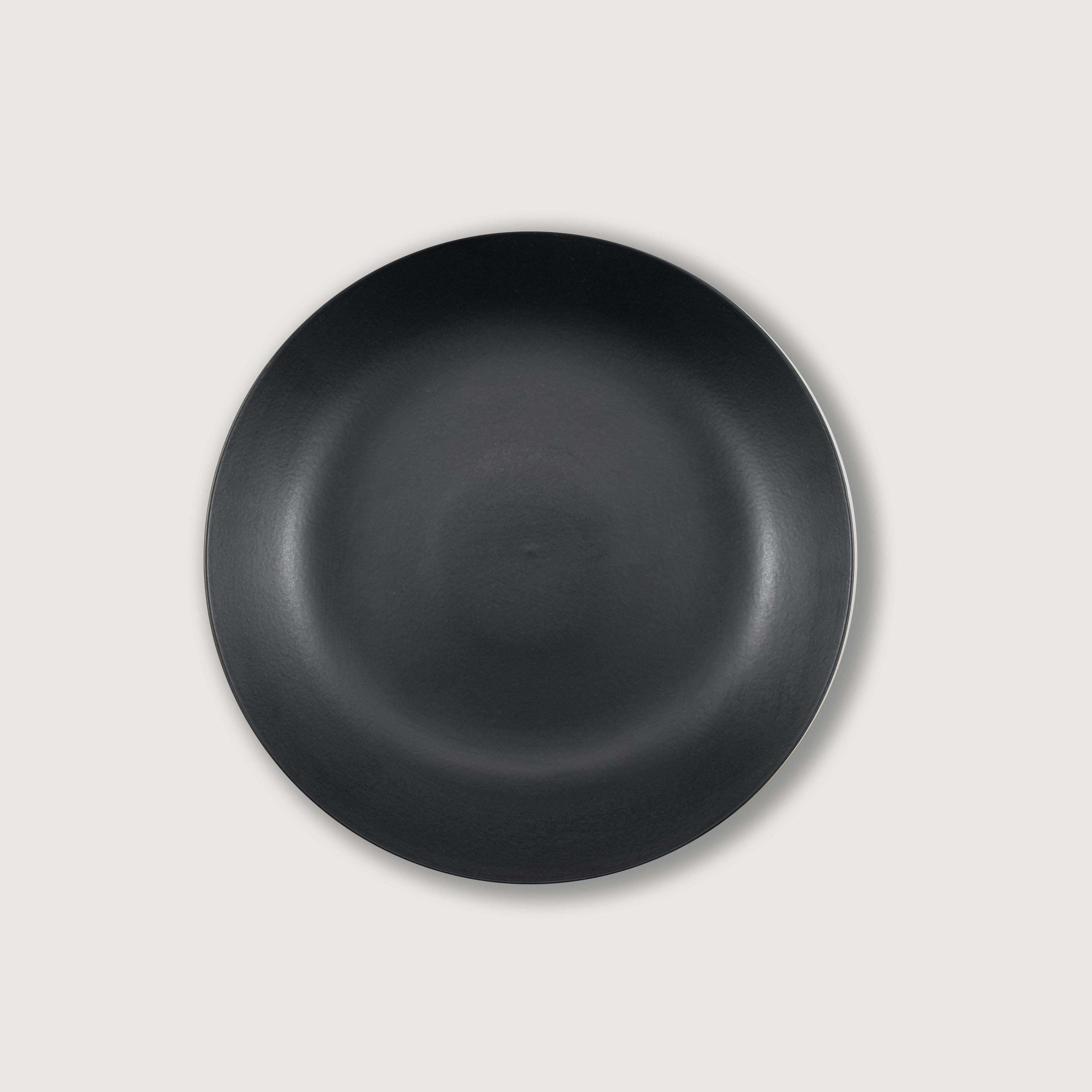 Matte Black Ceramic Footed Bowl, ideal for home decorations and fruit display, featuring a clean finish and hand-finished design.