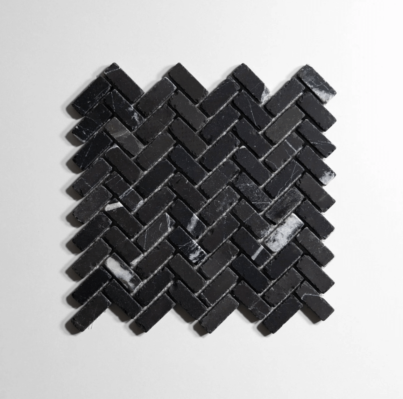 Nero St. Gabriel Tumbled Mini Herringbone Marble Tile