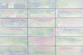Iris Subway Tile 2"x6" in soft pastel iridescent color, perfect for modern kitchen or bathroom decor.
