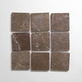 Cafe Tenayo 4x4 tumbled brown marble tiles arranged in a square pattern, showcasing natural texture and color.